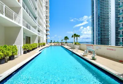 a swimming pool in the middle of a building at Condo with Panoramic City Views in Brickell in Miami