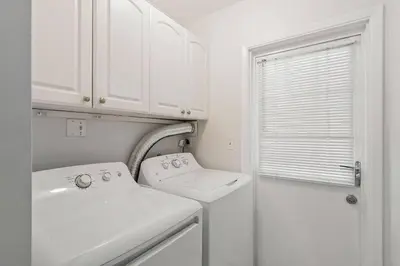 a white bathroom with a sink and a toilet at 3br Oasis near Coral Gable in Miami