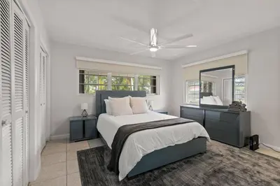 a bedroom with a bed and a ceiling fan at 3br Oasis near Coral Gable in Miami