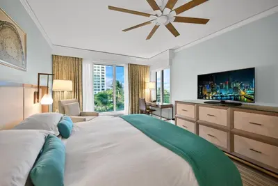 a bedroom with a large bed with a flat screen tv at Stylish Suite to Have a Great Stay! in Miami