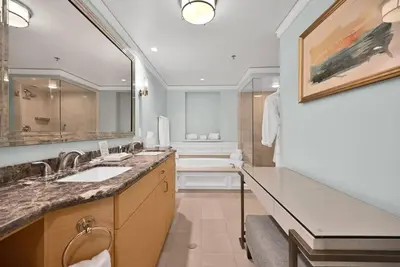 a bathroom with two sinks and a large mirror at Stylish Suite to Have a Great Stay! in Miami