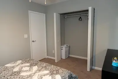 a bedroom with a bed and a closet at Cozy and Modern Vacation Home in Hallandale Beach