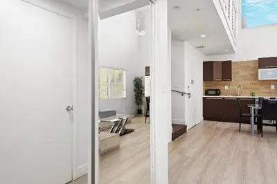 an open kitchen and dining room in a house at Ocean Drive Apartment Suites in Miami Beach in Miami Beach