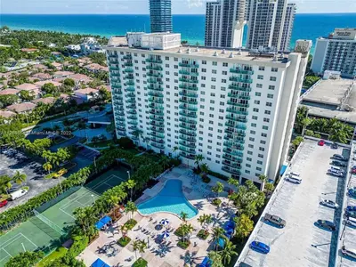 an aerial view of a large building with a tennis court at Condominium Sunny Isles Ocean Reserve in Sunny Isles Beach