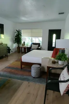 a living room with a white bed and a couch at Spacious Family 3BR Near Wynwood and Beach in Miami