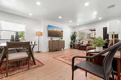 a living room with a table and chairs and a living room at Spacious Family 3BR Near Wynwood and Beach in Miami