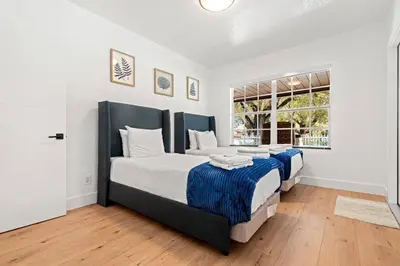 a bedroom with two beds and a window at Spacious Family 3BR Near Wynwood and Beach in Miami