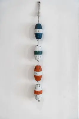 a bead necklace with colorful beads on a white background at Biscayne Shore #2 - 3 2 - Charming and Tropical in Miami