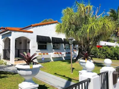 a white house with a fence in front of it at Casa Havana Renovated 3 2-Near Brickell&Downtown in Miami