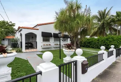 a white fence in front of a house at Casa Havana Renovated 3 2-Near Brickell&Downtown in Miami
