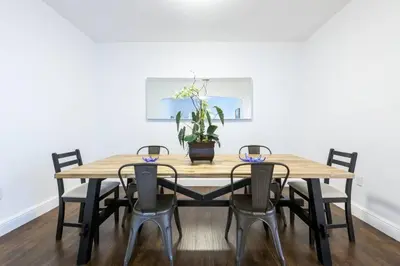 a dining room table with four chairs and a potted plant at Casa Havana Renovated 3 2-Near Brickell&Downtown in Miami