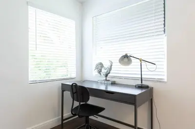 a desk with a lamp and a chair in a room at Casa Havana Renovated 3 2-Near Brickell&Downtown in Miami