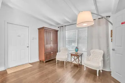 a living room with two white chairs and a table at Casa Santorini - Chic 4 2 near Grove & Brickell in Miami