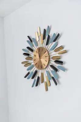 a brown and black clock on a white background at Homey Studio near the Airport and Water Park in Miami