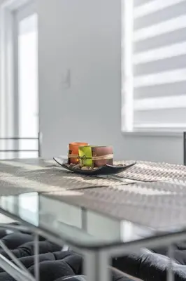 a plate on top of a glass table at Homey Studio near the Airport and Water Park in Miami