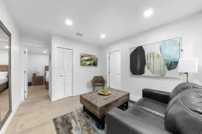 a living room with a couch and a table at Mykonos Home - 2 2 Cozy and Charming Duplex in Miami