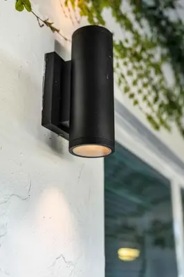 a black light hanging on the side of a building at Renovated Gem: Prime Spotless Ideal in Miami