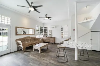 a living room with a couch and a table at Treehouse Hotel in Miami
