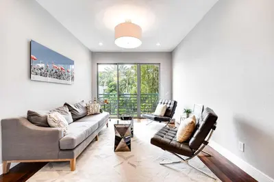 a living room with a couch and two chairs at 4-Bed + Den with pool in Las Olas Ft Lauderdale in Fort Lauderdale