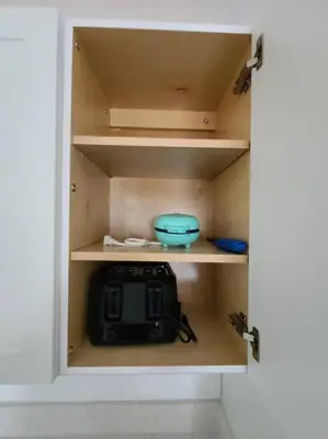a cabinet with a bowl and a radio in it at West Brickell APT #1 Free Parking-Family Friendly in Miami