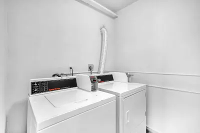 a white laundry room with a washer and dryer at West Brickell - #3 - Renovated 2 1 & Parking in Miami
