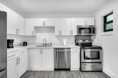 a kitchen with white cabinets and stainless steel appliances at West Brickell - #3 - Renovated 2 1 & Parking in Miami