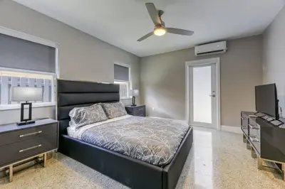 a bedroom with a bed and a ceiling fan at Sunshine Manor 2009 in Fort Lauderdale