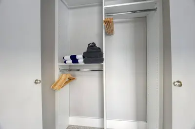 a walk in shower with a mirror in a bathroom at Sunshine Manor 2013 in Fort Lauderdale