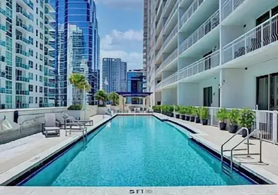 a swimming pool in the middle of a building at Upscale Apartment in the Heart of Brickell in Miami