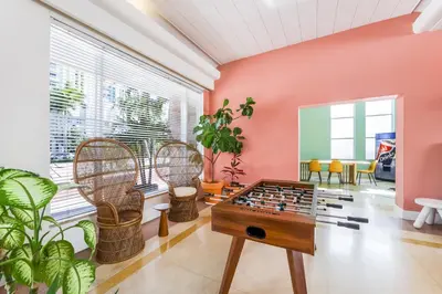 a living room with a chess board and chairs at Tropics Hotel Miami Beach in Miami Beach