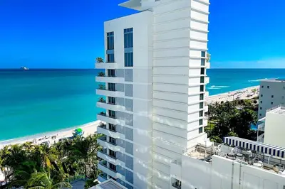 an aerial view of a building and the beach at FontaineBleau Resort Balcony w Ocean and City View in Miami Beach