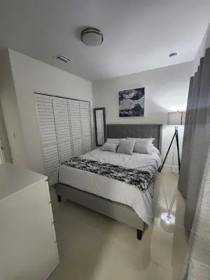 a bedroom with a large bed in a room at The 305 in Miami