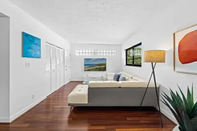 a living room with a couch and a table at 7 Minutes to Beach Saltwater Pool Open Floor Plan in Fort Lauderdale