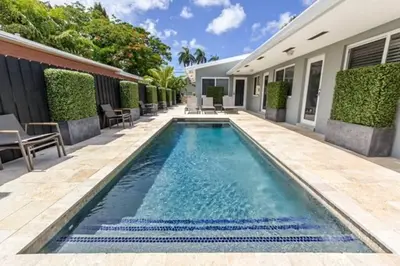a swimming pool in the backyard of a house at WiltonPlex A in Fort Lauderdale