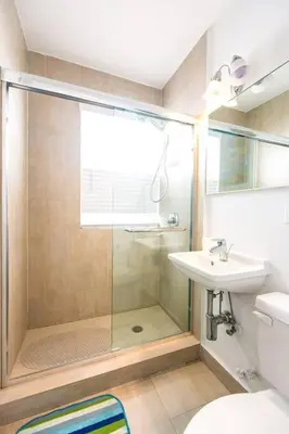 a bathroom with a shower and a sink at 1 Bedroom 5 minutes walk to Beach on Washington Ave in Miami Beach