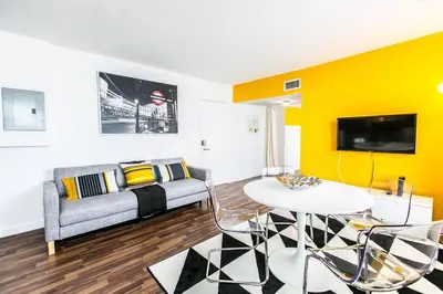 a living room with a couch and a table at 1 Bedroom 5 minutes walk to Beach on Washington Ave in Miami Beach