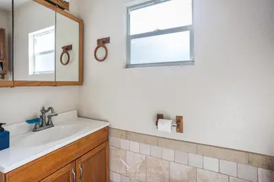 a bathroom with a sink and a mirror at Villa Fiesta - Celebrate Dreams Create Memories in Southwest Ranches