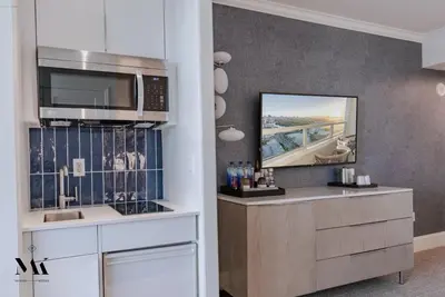 a kitchen with a counter with a microwave and a sink at FontaineBleau Resort High Floor w Ocean Views in Miami Beach