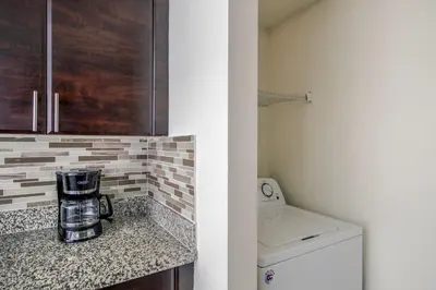 a kitchen with a counter with a coffee maker on it at Coral Gables 2br w wd pool gym near shops MIA-83 in Miami