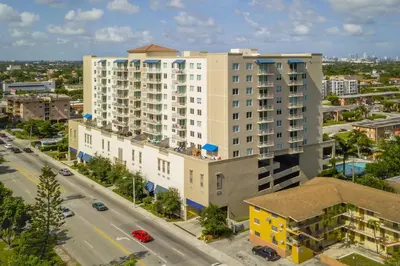 an aerial view of a large building in a city at Coral Gables 2br w wd pool gym near shops MIA-83 in Miami