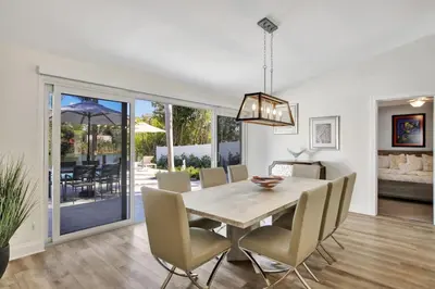 a dining room with a table and chairs at Lakefront Family Fun Home with Private Dock 3BR 2B in Fort Lauderdale