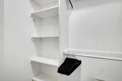 a white refrigerator with a black towel on a rack at Wilton on the water courtyard and Heated Pool in Fort Lauderdale