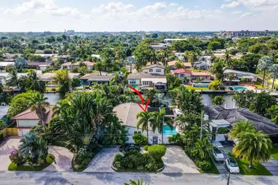 an aerial view of a house with palm trees at Wilton on the water courtyard and Heated Pool in Fort Lauderdale