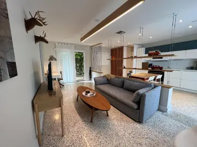 a living room with a couch and a table at Cozy house close Brickell in Miami