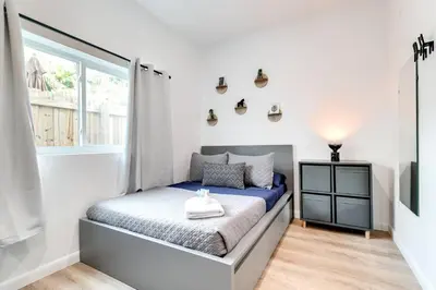 a small bedroom with a bed and a window at Coral Way Studio in quiet area Fast Internet Shen 1 in Miami