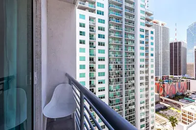 a balcony with a view of a tall building at Beautiful Loft in Downtown Miami For 4 people 2208 in Miami