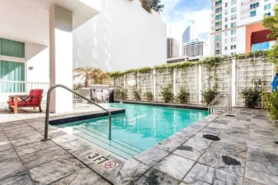 a swimming pool on the side of a building at Beautiful Loft in Downtown Miami For 4 people 2208 in Miami