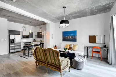 a living room with a couch and a table at Beautiful Loft in Downtown Miami For 4 people 2208 in Miami