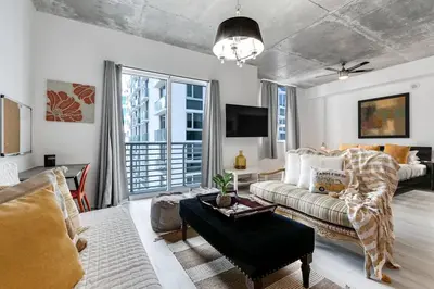 a living room with a couch and a table at Beautiful Loft in Downtown Miami For 4 people 2208 in Miami