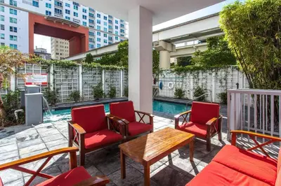 a patio with chairs and a table and a pool at Beautiful Loft in Downtown Miami For 4 people 2208 in Miami